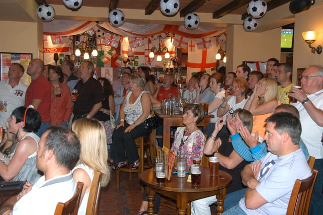 Back to 2010 and England fans watch the TV screens in The Chesters as the team takes on Algeria.