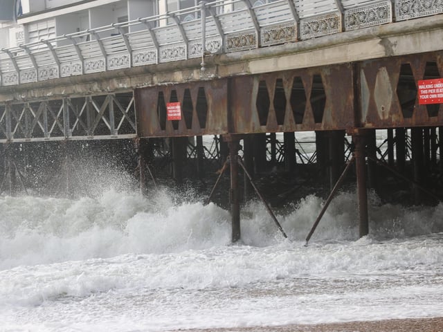 South Parade Pier saw large waves crashing against it. Photos by Alex Shute