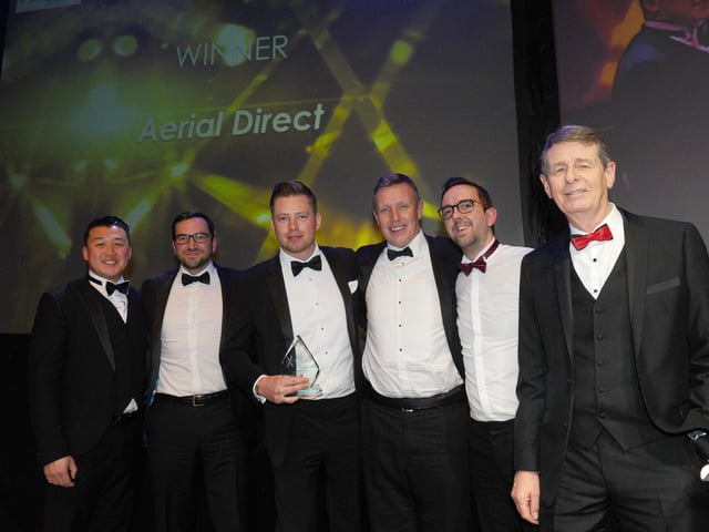 Bill Moulsdale from Giant Leap Video & Photography with winners of the Large Business of the Year Award 
(210220-8429)