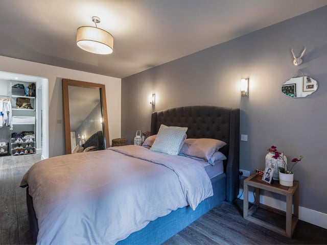This bedroom comes with quite frankly, and obscenely lovely wardrobe room.