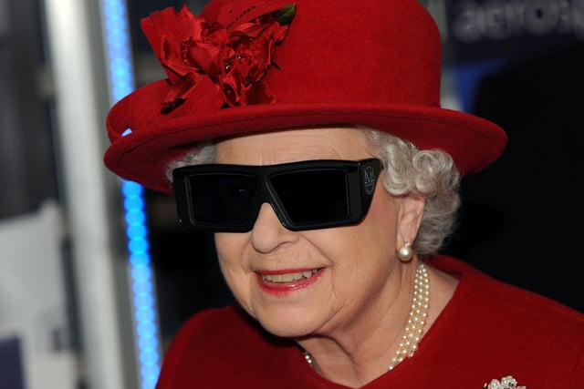Queen Elizabeth II  wears 3 D glasses to watch a display and pilot a JCB digger during a visit to the University of Sheffield Advanced Manufacturing Research centre, November, 18, 2010