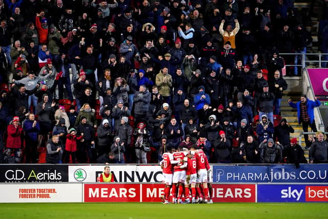 Rotherham United's Ollie Rathbone celebrates with his team-mates after scoring against Wigan Athletic at the AESSEAL New York Stadium. Picture: Zac Goodwin/PA Wire.