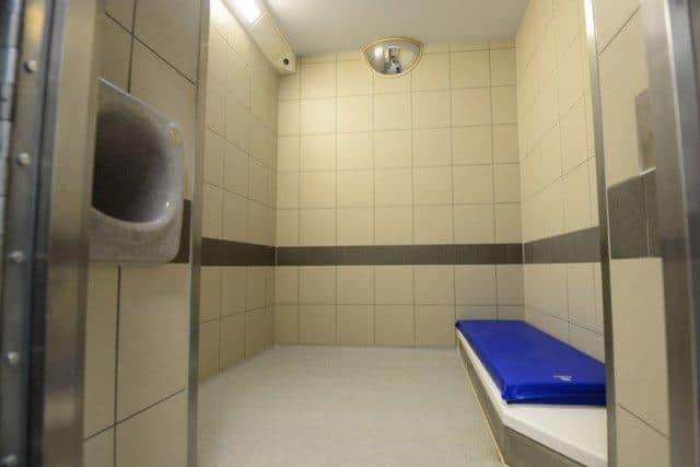 Custody navigators speak to people who have been arrested for violent crimes from their prison cell. Pictured is one of the cells at Shepcote Lane police station, where the South Yorkshire violence reduction unit is based