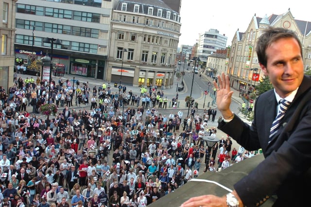 Ashes-winning England cricket captain Michael Vaughan waves to fans from the balcony of Sheffield Town Hall