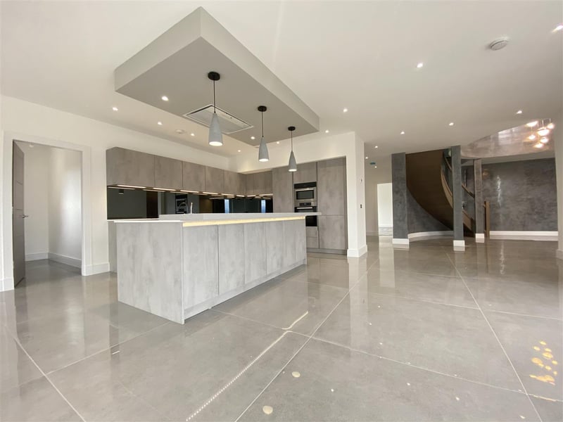 Located in Thorntonhall, Glasgow, this incredible villa is on the market for offers over £1,290,000. The property includes a gated entrance and a spectacular feature staircase.