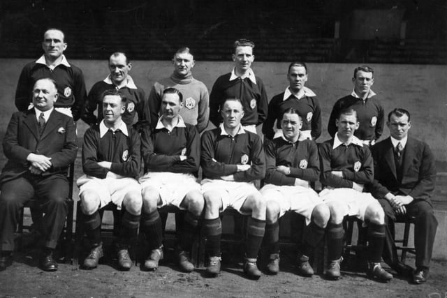 Chapman and his Arsenal team (back row, left to right) Tom Parker, Jones, goalkeeper Frank Moss, Roberts, John, Tommy Black, (front row) manager Herbert Chapman, Joe Hulme, David Jack, Jack Lambert, Alex James, Cliff Bastin, trainer Tom Whittaker on 15th April 1932:  They were runners-up in the league and lost in the FA Cup final.
