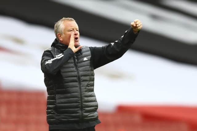 Sheffield United's manager Chris Wilder gestures to his players from the sidelines during the match between Arsenal and Sheffield United at the Emirates Stadium in London,. (Clive Rose/Pool via AP)