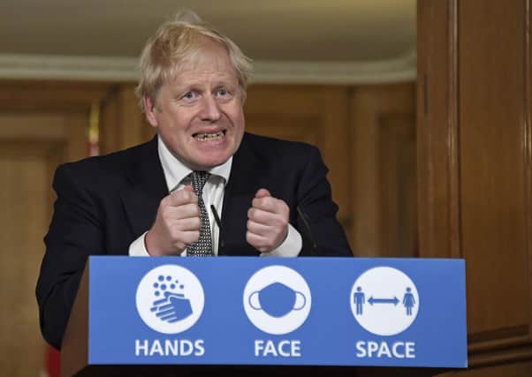 Prime Minister Boris Johnson announces the national lockdown during a media briefing on Saturday