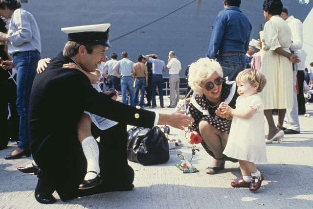 A Royal Navy serviceman is reunited with his family after the British light aircraft carrier HMS Invincible returned to Portsmouth after the Falklands War, 17th September 1982. (Photo by Hulton Archive/Getty Images)