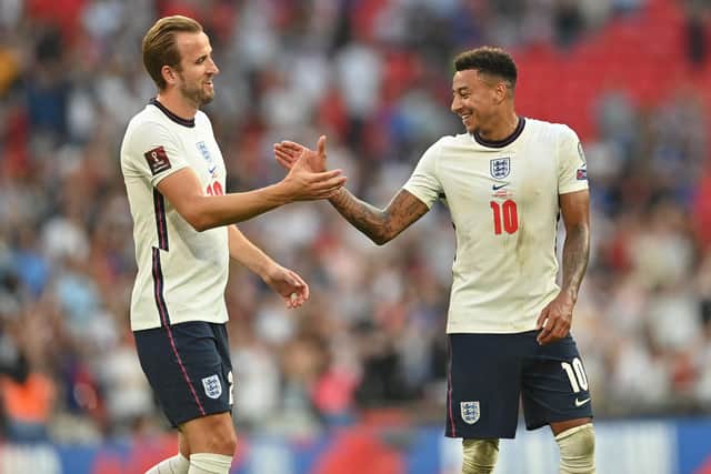 England's striker Harry Kane (L) and England's midfielder Jesse Lingard (R) celebrate on the pitch after the FIFA World Cup 2022 qualifying match between England and Andorra at Wembley Stadium (Photo by JUSTIN TALLIS/AFP via Getty Images)