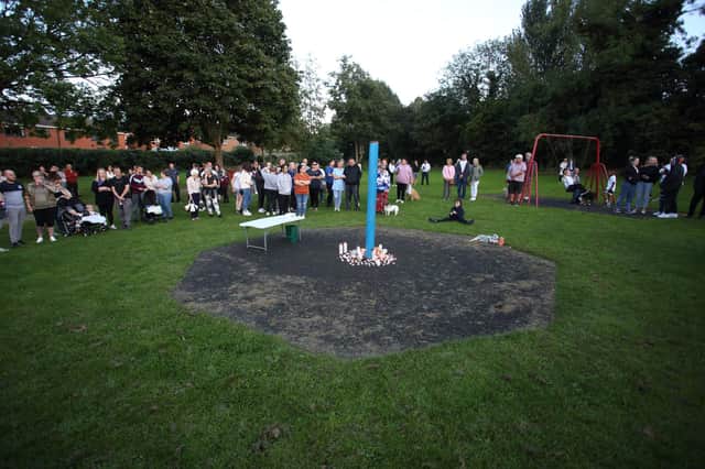People attend a vigil near to the murder scene at Chandos Crescent, in Derbyshire, September 20, 2021.