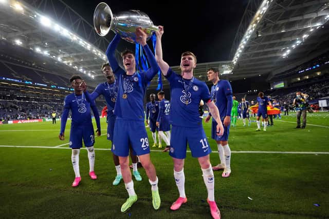 Chelsea's German midfielder Kai Havertz (L front) and Chelsea's German forward Timo Werner (R front) hold the Champions League trophy as they celebrate after winning the UEFA Champions League final football match between Manchester City and Chelsea at the Dragao stadium in Porto on May 29, 2021. (Photo by Manu Fernandez / POOL / AFP) (Photo by MANU FERNANDEZ/POOL/AFP via Getty Images)