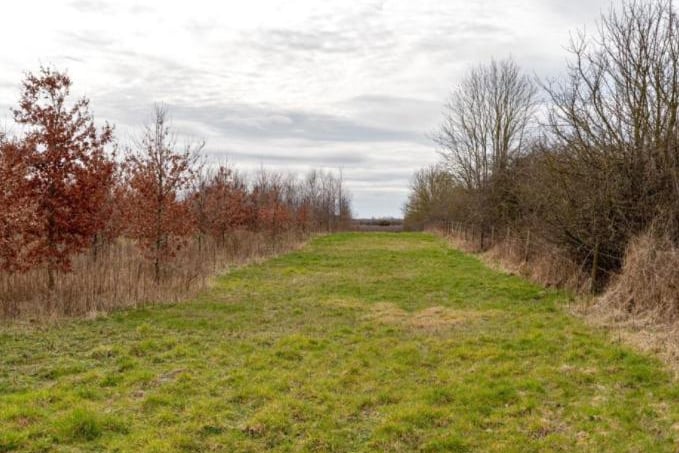 The detached property boasts approximately 24 acres of woodland/grassland.