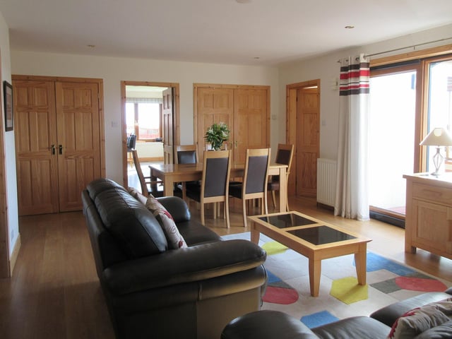 The open-plan living and dining area offers flexible use of space