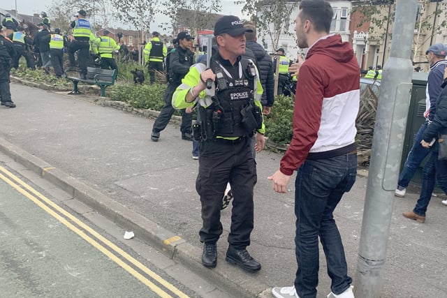 Police ran their 'biggest ever football operation' in Hampshire on September 24 as Pompey played Southampton at Fratton Park for the third round of the Carabao Cup.

Pictured is: Police and Blues fans in Goldsmith Avenue.

Picture: Ben Fishwick (240919-9771)