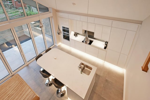 A look down on the kitchen area from the second floor mezzanine.