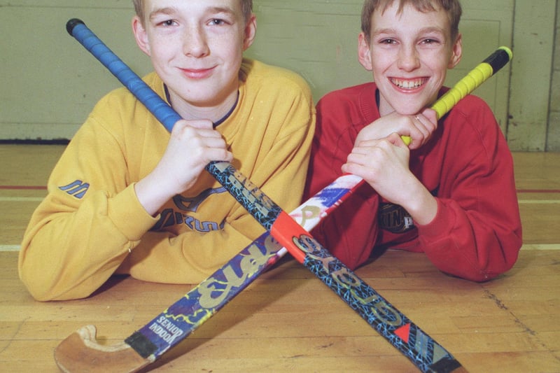 Twins Martin and Bernard Samways, left, aged 14, from Intake fool the opposition in the hockey match..