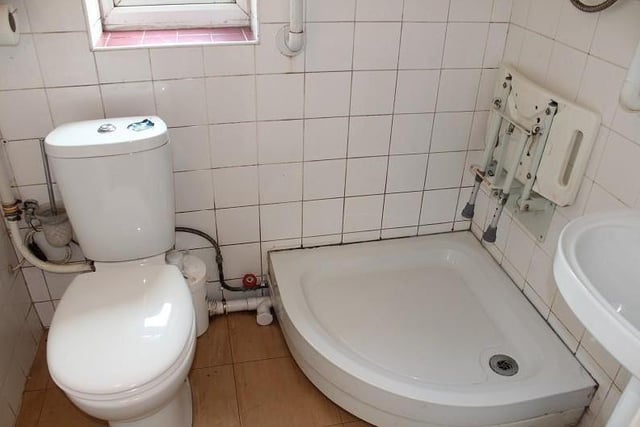 OK, it needs sprucing up, but the ground-floor bathroom boasts all you need. A shower tray is complemented by a pedestal wash hand basin and low-level WC.