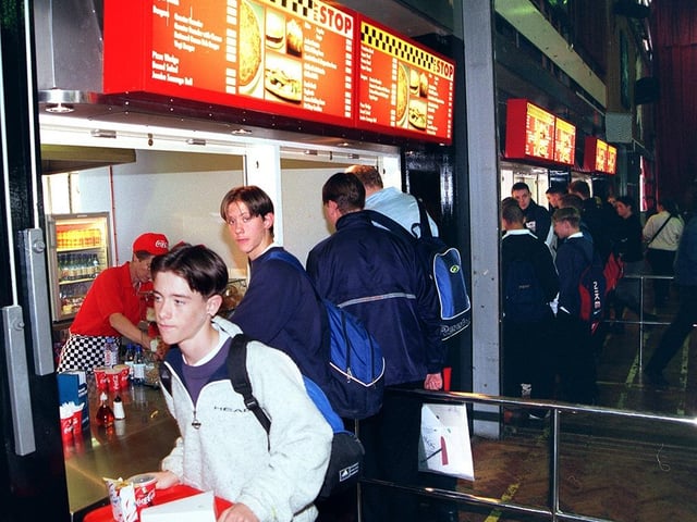 Pupils queue to use the new look fast food restaurant, the Pit Stop, at Myers Grove School in October 1999
