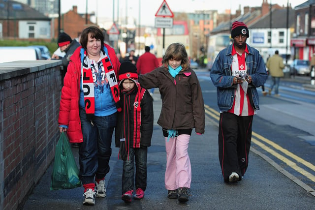 United fans make their way to Bramall Lane for the FA Cup fourth round tie with Birmingham City in January 2012.