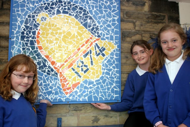 Eckington pupils Lilli Greshan, Victoria Holmes and Tia Lowe-Fowler with the new mosaic