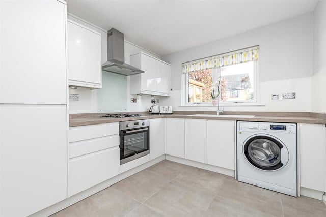 The kitchen boasts modern high gloss handless units and has ample worktop surface, gas hob and a full walled larder unit providing excellent storage and space for free standing appliances.
