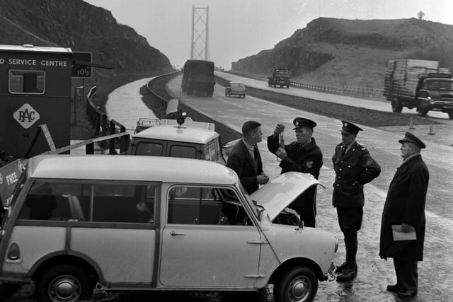 The RAC provide anti-freeze for motorists at the northern end of the Forth Road Bridge in December 1965.