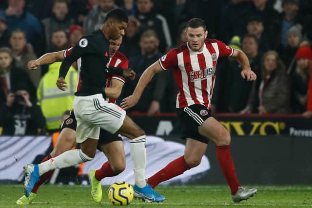 Phil Jagielka and Jack O’Connell of Sheffield United combine to stop Marcus Rashford of Manchester United: Simon Bellis/Sportimage