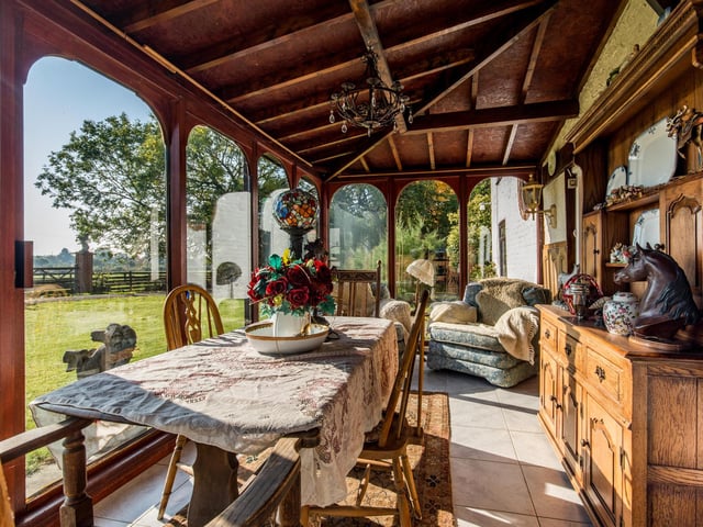 The conservatory looks out onto the fields.