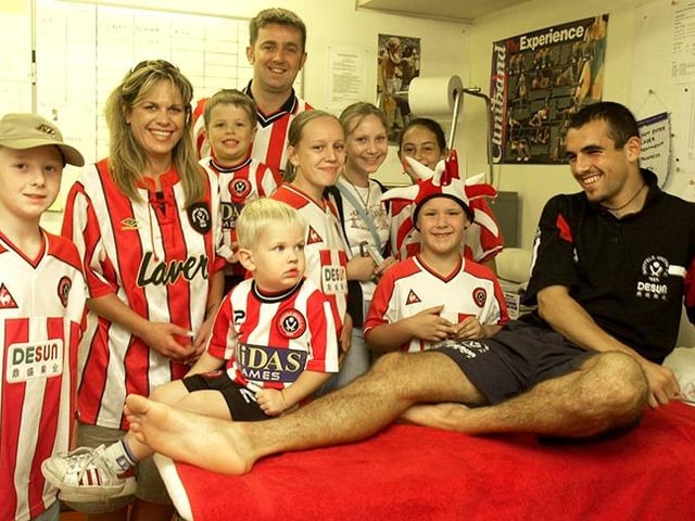 Blades fans in the physio room with player Anthony Tansley at the Sheffield United Open Day on August 3, 2003