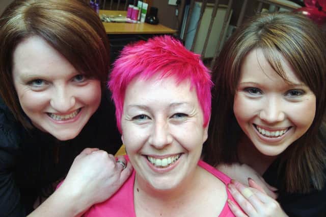 Sue Peat from Mansfield showed off her new hair-do  in 2008 after letting Forest Town hairdressers Jaime Newton, left, and Helen Strouther, co-owners of Stubborn Hair Co., give her a make over in aid of the Breast Cancer Campaign.  Sue hopes to raise around £250 for the charity with much of it coming from her employer, Future Products of Mansfield.