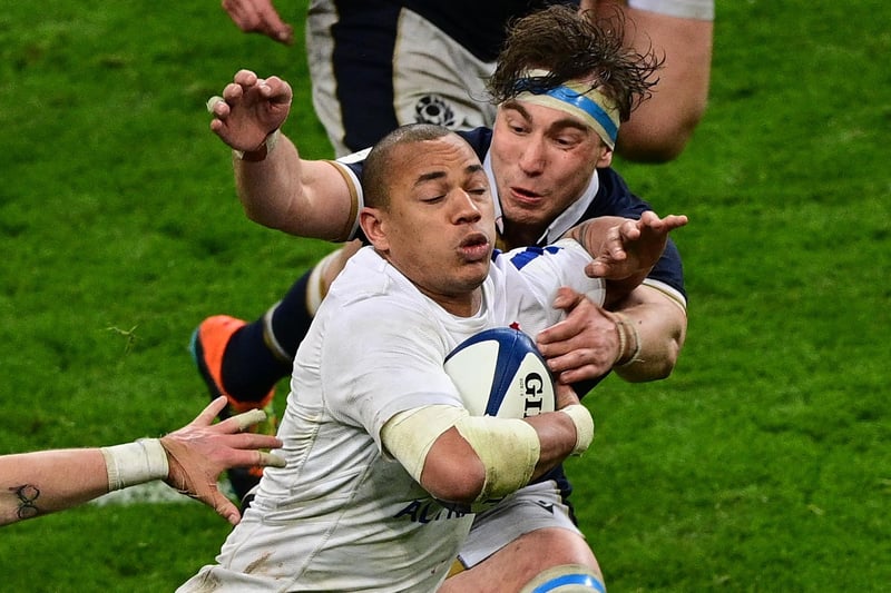 France wing Gael Fickou being tackled by Scotland flanker Jamie Ritchie tonight (Photo by Martin Bureau/AFP via Getty Images)