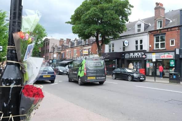 Floral tributes were left near the spot where a woman was fatally injured in a collision on a major Sheffield road. The 60-year-old woman was involved in a collision with a grey Volkswagen Tiguan, on Ecclesall Road, in the early hours of Sunday, May 22, 2022, at around 1.38am. She sustained serious injuries and was taken to hospital, where she sadly died a short time later. The collision happened close to the Kettle Black bar on the popular city street.