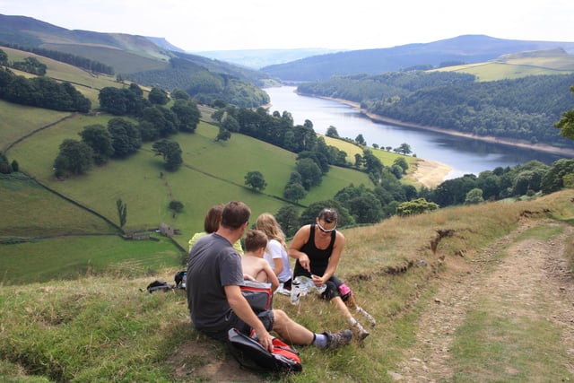 A family enjoying a picnic looking over Ladybower reservoir in  2011