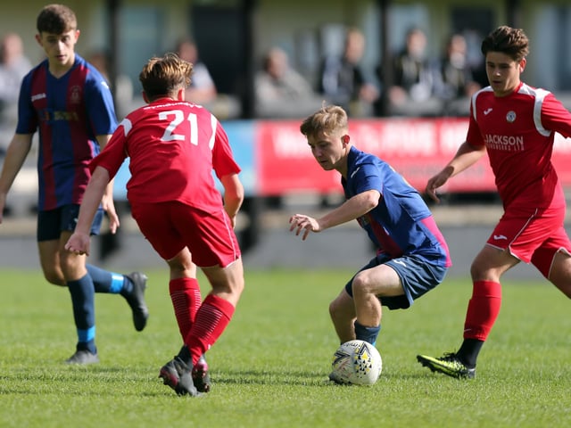 Max Innalls (21) about to challenge Toby Toman. Picture: Chris Moorhouse