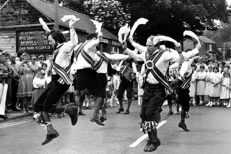 Sheffield City Morris Men performing at Grenoside Folk Dance Festival, Main Street, with the Old Harrow Inn in the background, on July 7, 1984. Ref no: s29025
