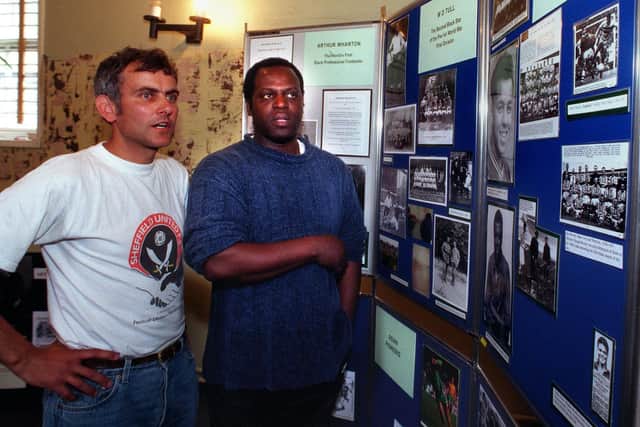 Football historian Phil Vasili and ex-Sheffield United player Trenton Wiggan looking at the History of Black footballers exhibition
