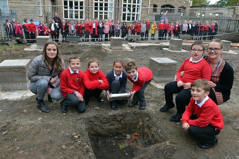 Highfield Hall Primary School year 3 pupils planting a time capsule. Harry, Susie, Elliott, Lily, Alex and Tommi-Lee with teachers Miss Sullivan and Mrs Webster.