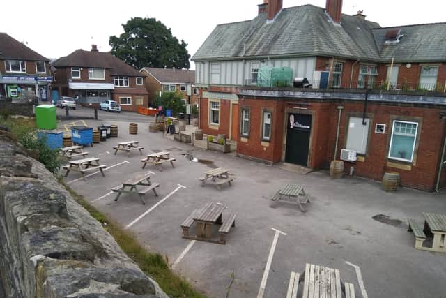 The car park at The Greystones is now used for seating. Taken in July last year, It has since had a gazebo installed.