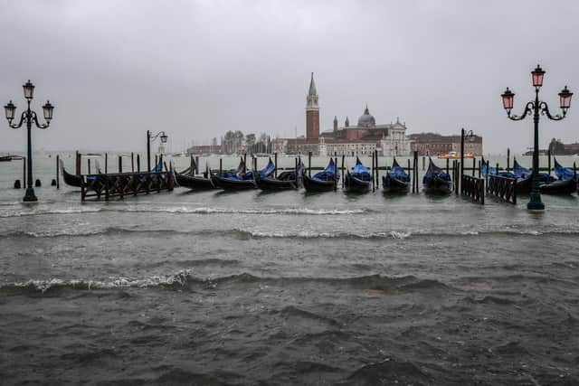 This Star reader believes many cities will be constantly flooded - and Venice and other cities uninhabitable - if we don't use alternative energy sources instead of oil, gas and coal.(Photo by MIGUEL MEDINA/AFP via Getty Images)