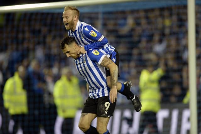 Barry Bannan congratulates Lee Gregory after his goal that put Sheffield Wednesday in front on the night   Pic Streve Ellis