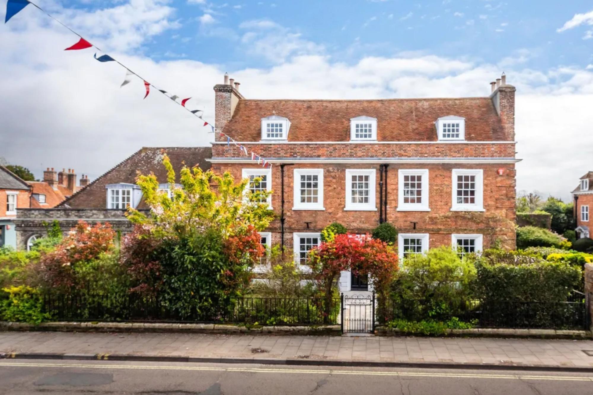 This listing says: "New to our John D Wood & Co Corporate portfolio, situated in Central Lymington, a prominent and historic house. I give to you, Monmouth House." 