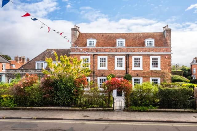 This listing says: "New to our John D Wood & Co Corporate portfolio, situated in Central Lymington, a prominent and historic house. I give to you, Monmouth House."