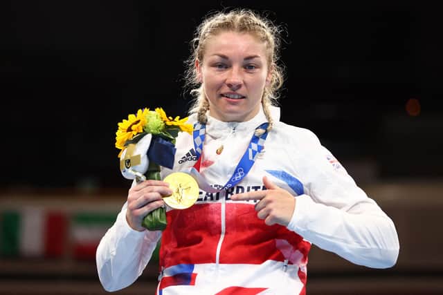 Britain's Lauren Price celebrates her gold medal.