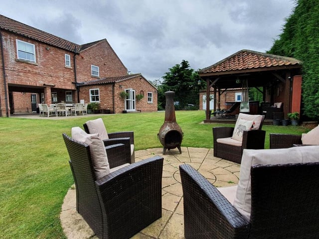 Externally there is a covered area with hot tub and relaxation area along other multiple seating areas within the extensive grounds.