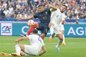 France's forward Kylian Mbappe (L) fights for the ball with Greece's defender George Baldock, who represents Sheffield United: ALAIN JOCARD/AFP via Getty Images