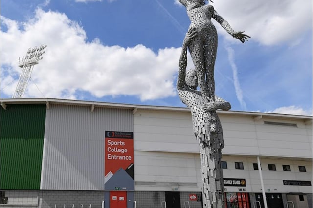 This sculpture of two figures is outside the Keepmoat Stadium.