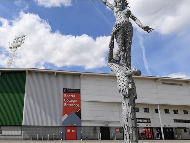 This sculpture of two figures is outside the Keepmoat Stadium.
