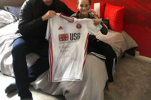 Freddie receives a signed shirt from former United boss Chris Wilder