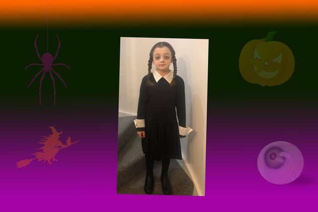 Lola Dennis, age 7, as Wednesday Addams for Halloween at school.